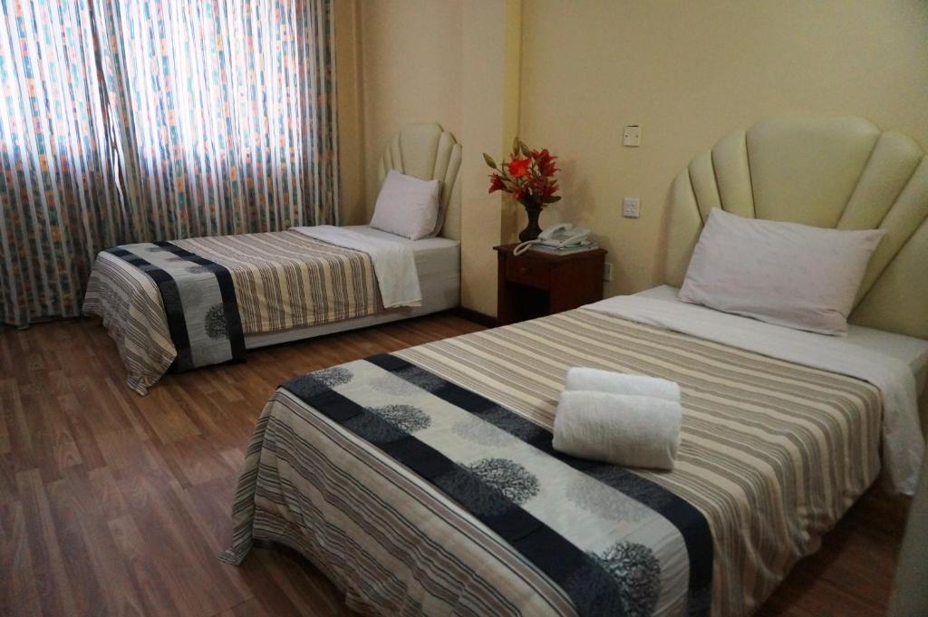 Postel nebo postele na pokoji v ubytování Jeruton Hotel