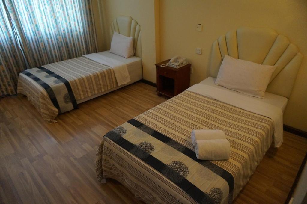 Postel nebo postele na pokoji v ubytování Jeruton Hotel