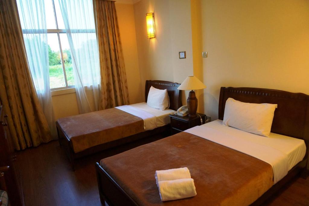 Postel nebo postele na pokoji v ubytování Jeruton Hotel