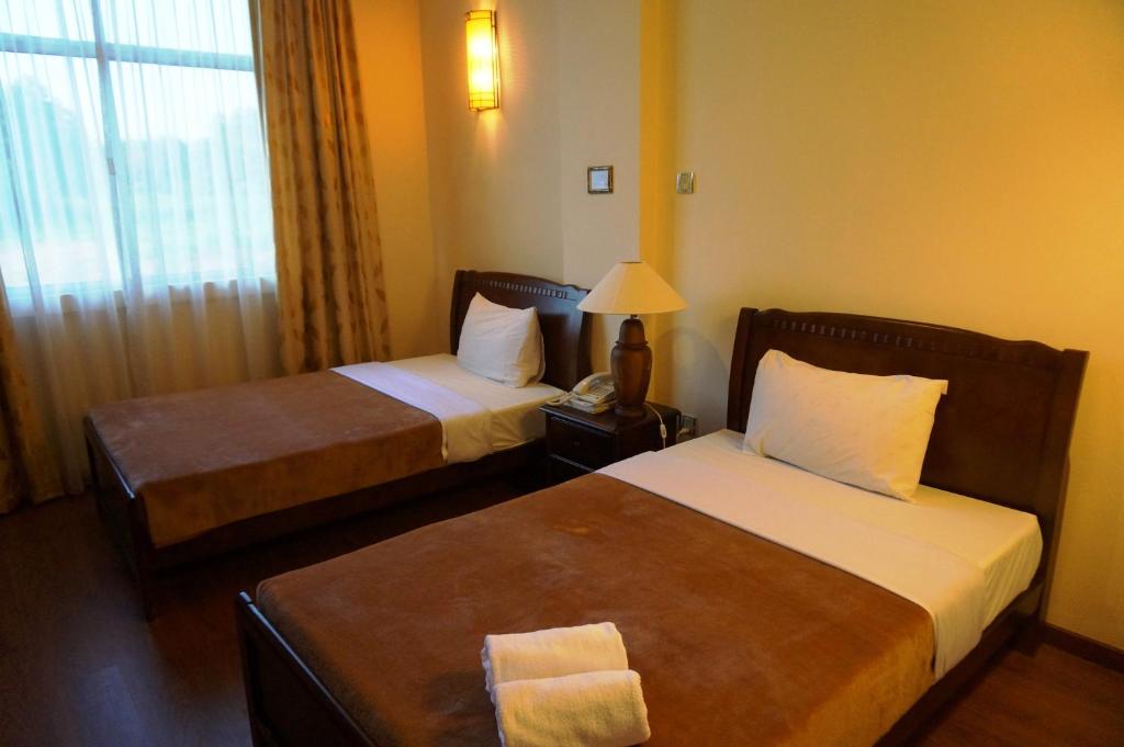 Postel nebo postele na pokoji v ubytování Jeruton Hotel