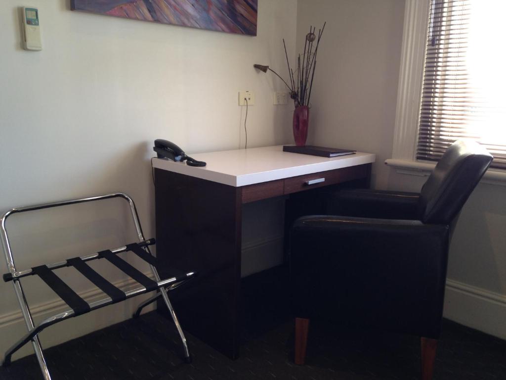 a office with a chair and a desk and a phone at Auldington Hotel in Launceston