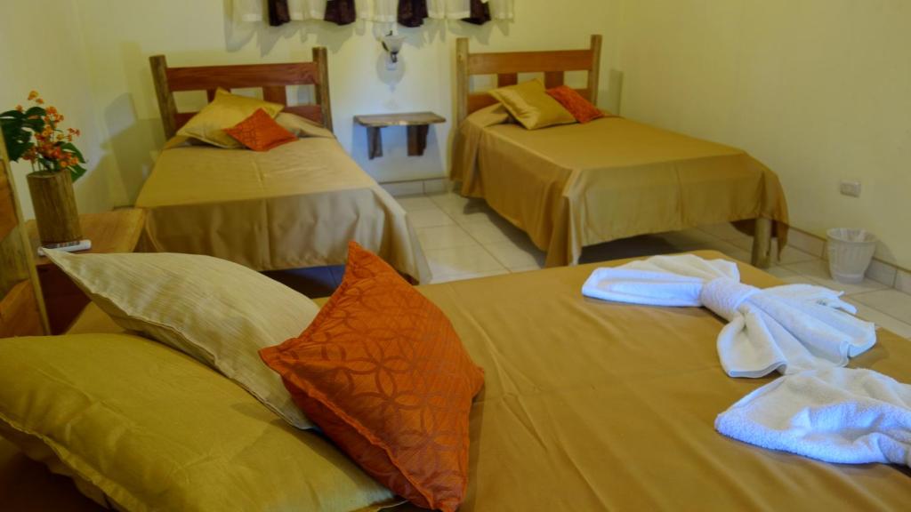 Postel nebo postele na pokoji v ubytování Hotel Cerro Lodge
