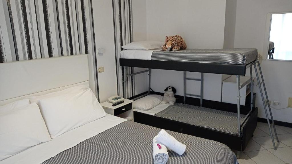 Letto o letti in una camera di Hotel Mizar