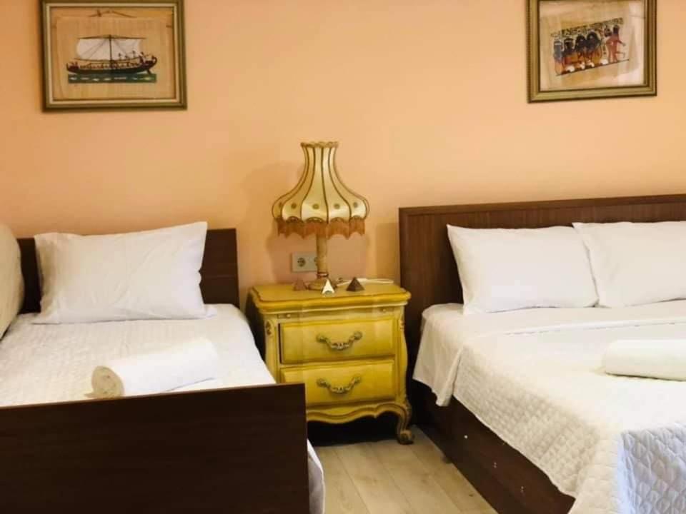 Postel nebo postele na pokoji v ubytování Villa Gardenia Ureki