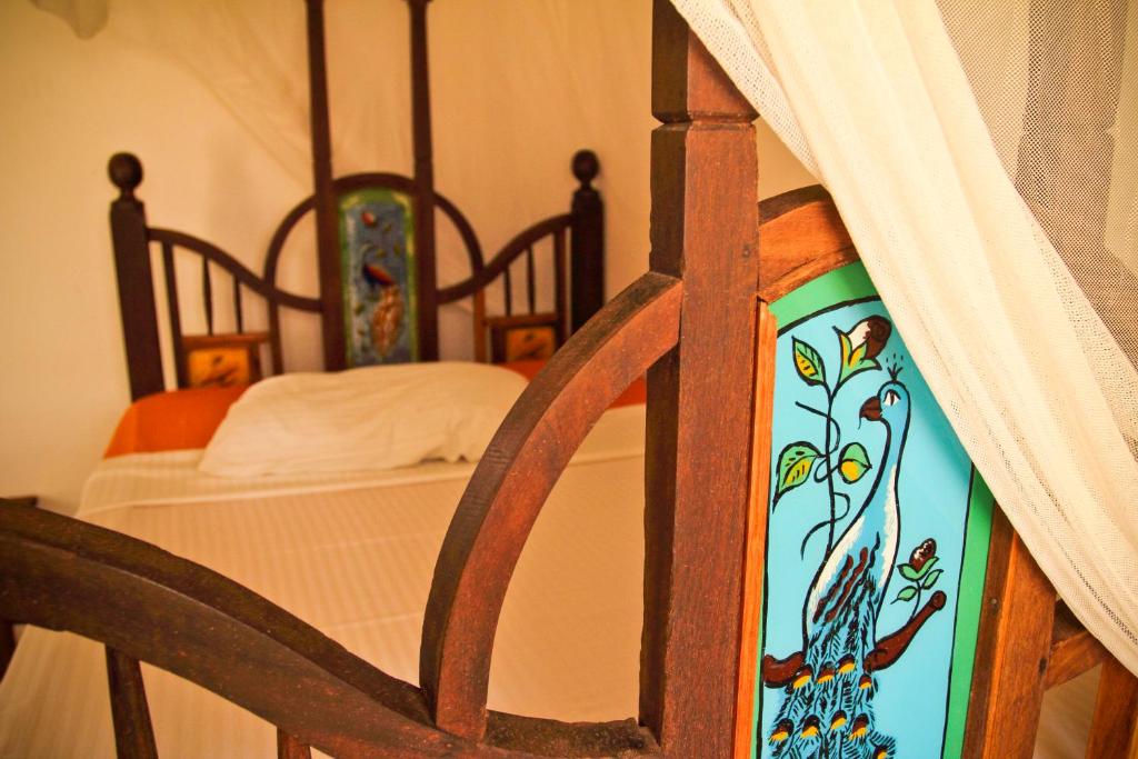 Postel nebo postele na pokoji v ubytování Kiponda B&B