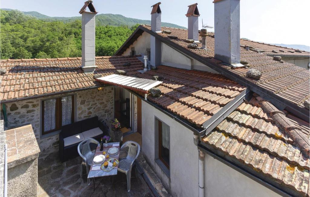 an overhead view of a house with a table and chairs at Lovely Apartment In Casoli Lu With Kitchen in Cocciglia