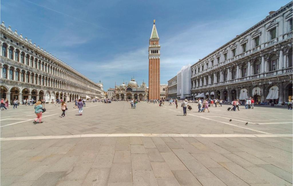 a large city square with a clock tower in the distance at Stunning Apartment In Venezia -Ve- in Venice