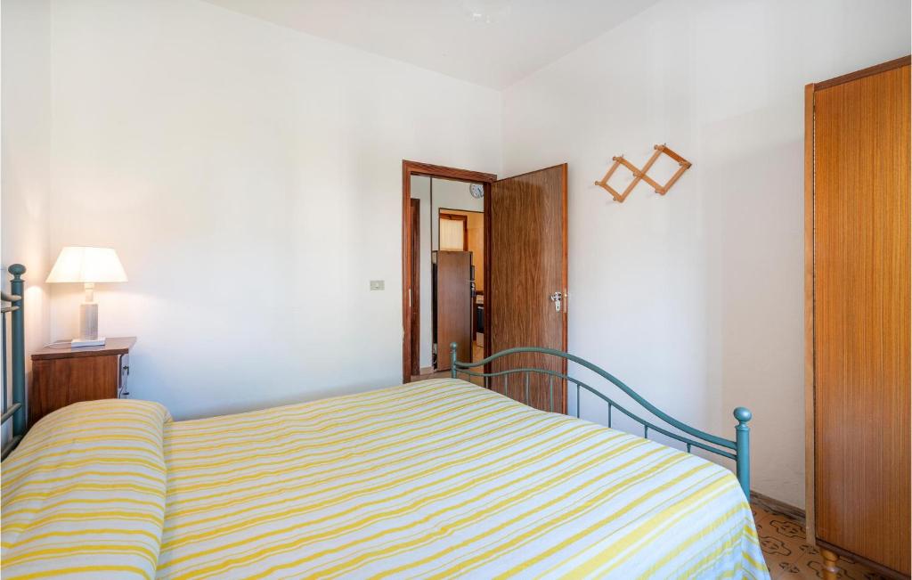 A bed or beds in a room at Aragosta 4