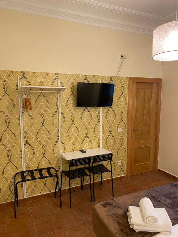 TV a/nebo společenská místnost v ubytování Hostal Alaska