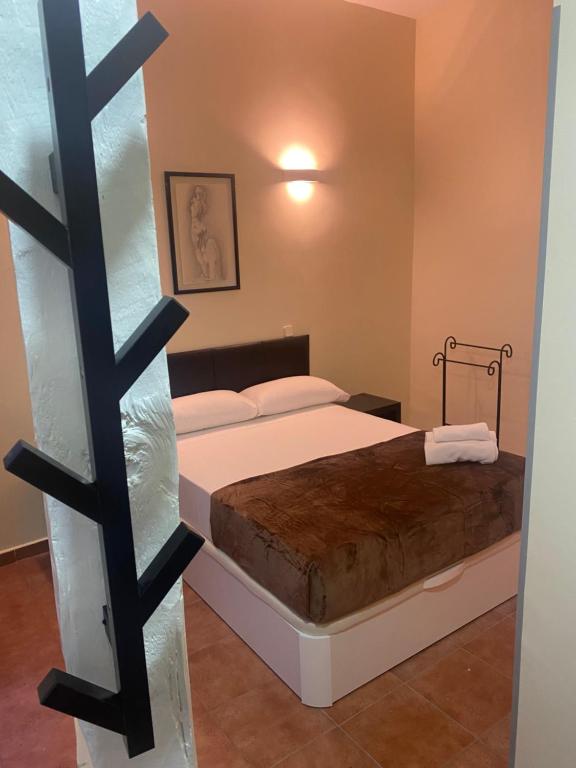 Postel nebo postele na pokoji v ubytování Hostal Alaska