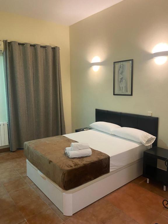 Postel nebo postele na pokoji v ubytování Hostal Alaska