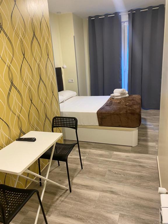 Postel nebo postele na pokoji v ubytování Hostal Alaska