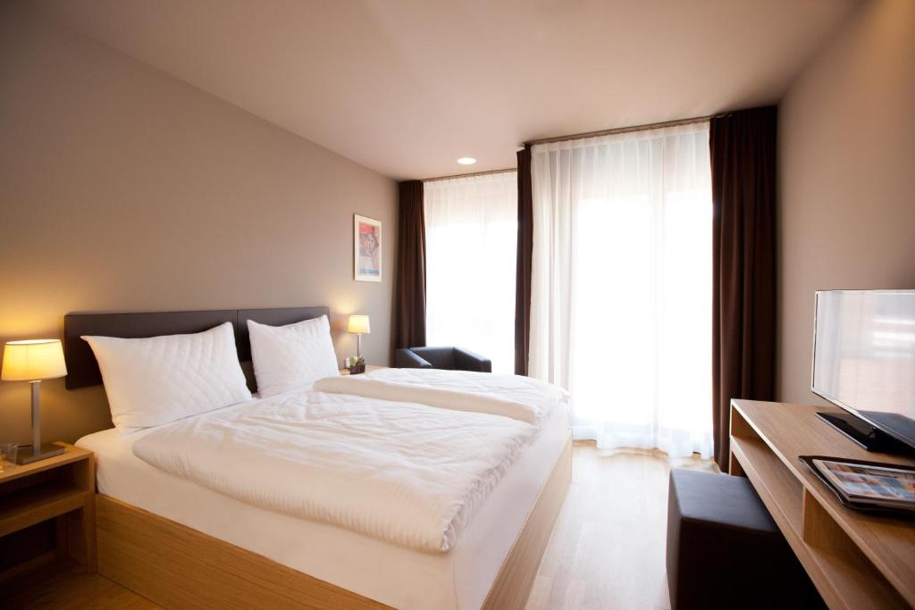 Postel nebo postele na pokoji v ubytování Hotel am Garnmarkt