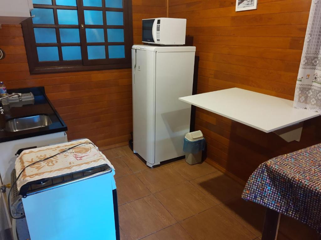 Kuchyň nebo kuchyňský kout v ubytování Chalés Araucárias da Serra