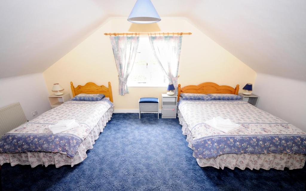 Postel nebo postele na pokoji v ubytování Fanore Holiday Cottages