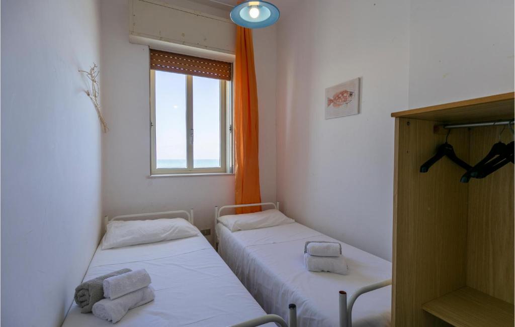 Posteľ alebo postele v izbe v ubytovaní La Casa In Riva Al Mare