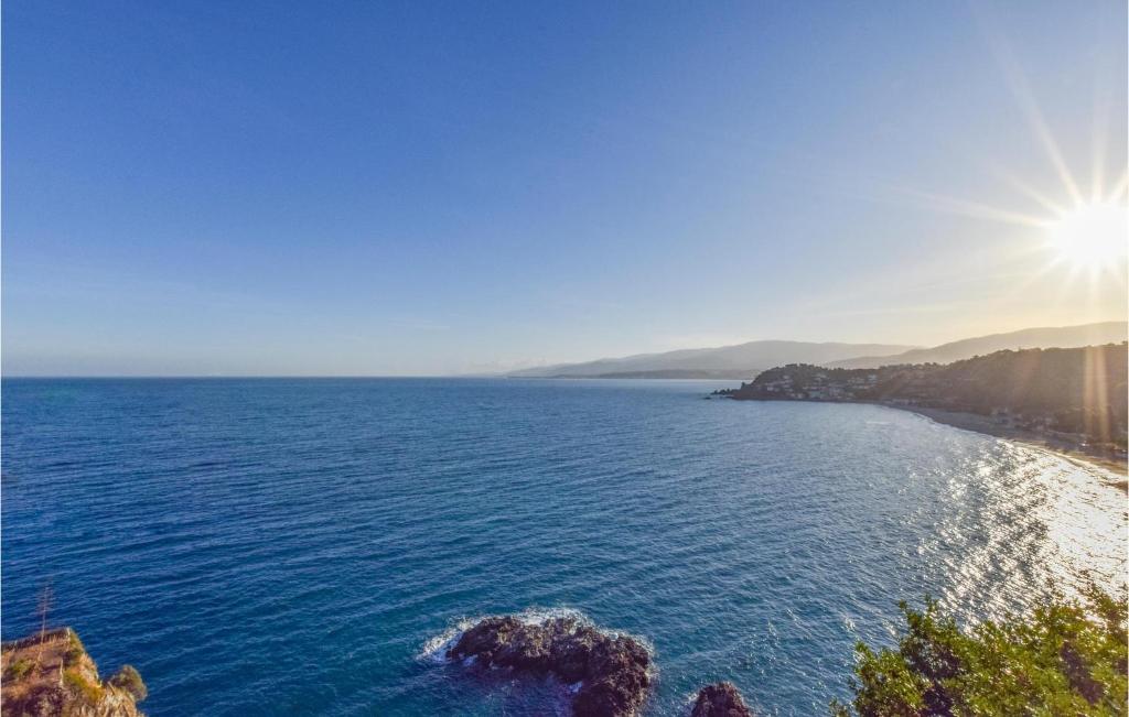 an aerial view of a beach with the sun shining at Villa Antica in Stalettì