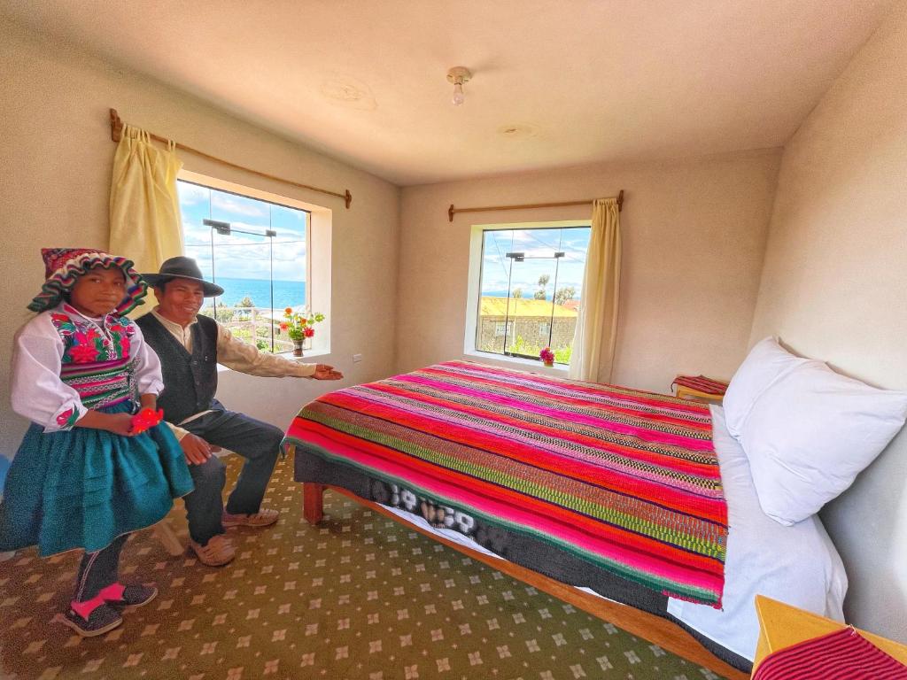 Letto o letti in una camera di Richar’s home - experience Amantani with my family