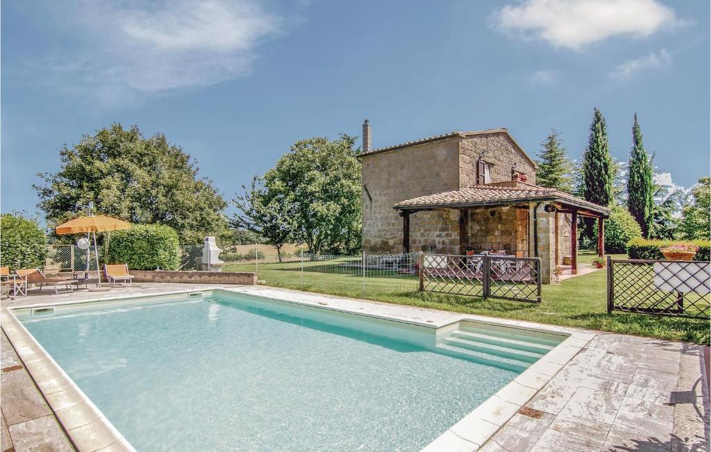 a swimming pool in the backyard of a house at Lortale in Pitigliano