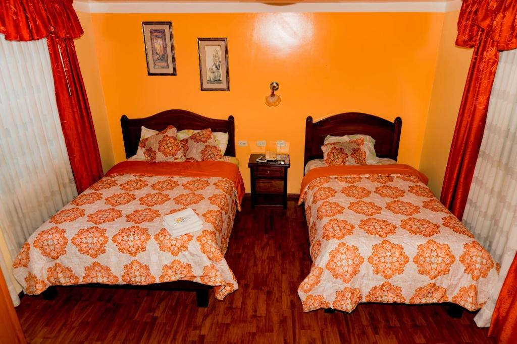 Postel nebo postele na pokoji v ubytování Hotel Los Ilinizas