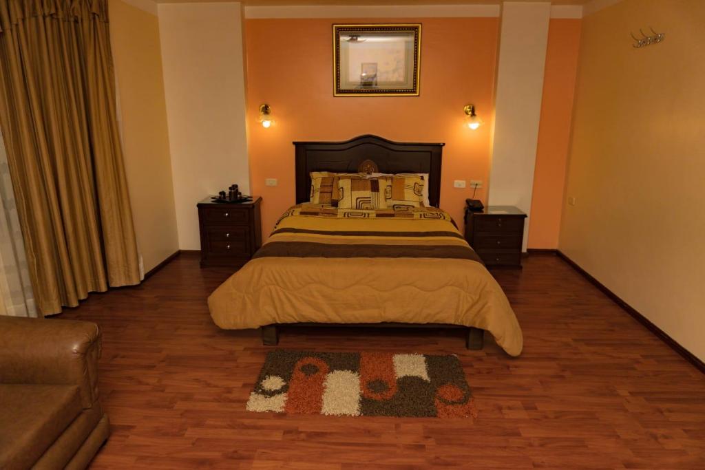 Postel nebo postele na pokoji v ubytování Hotel Los Ilinizas