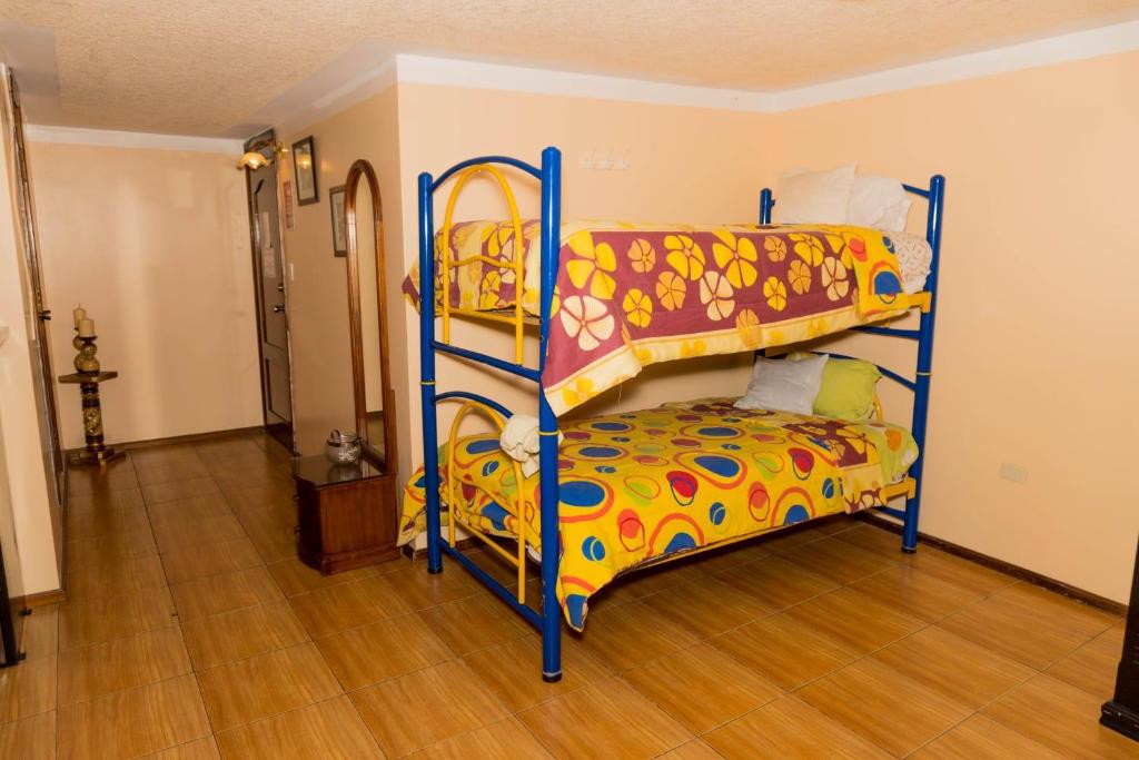 Postel nebo postele na pokoji v ubytování Hotel Los Ilinizas