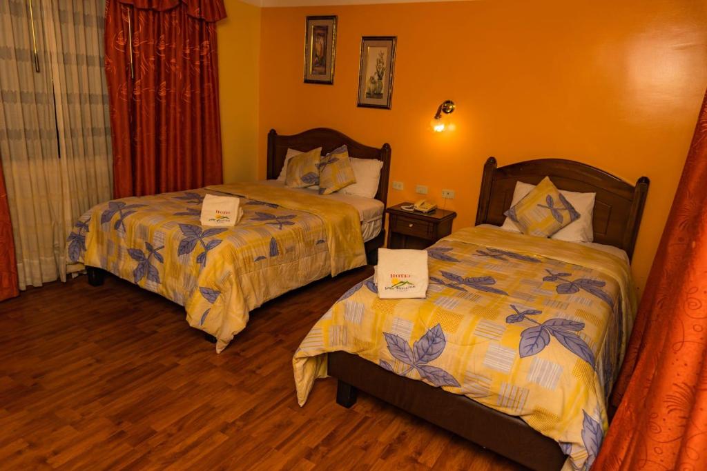 Postel nebo postele na pokoji v ubytování Hotel Los Ilinizas