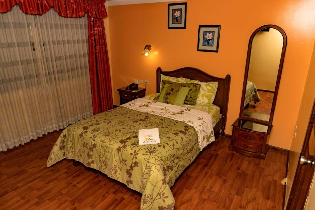 Postel nebo postele na pokoji v ubytování Hotel Los Ilinizas