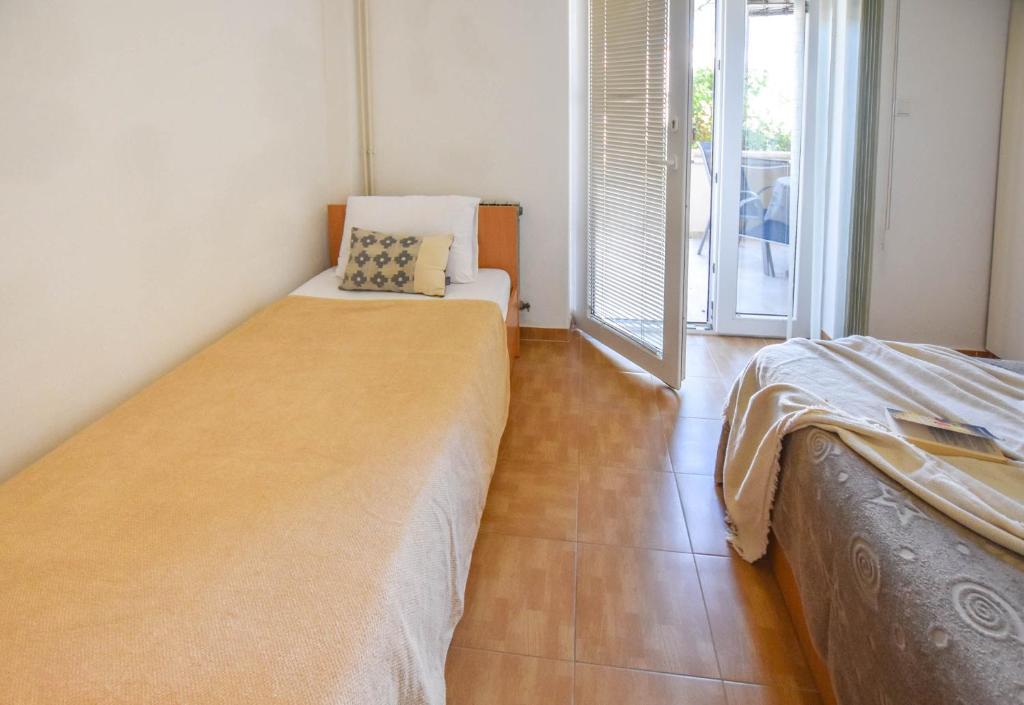 Posteľ alebo postele v izbe v ubytovaní Apartments Flora