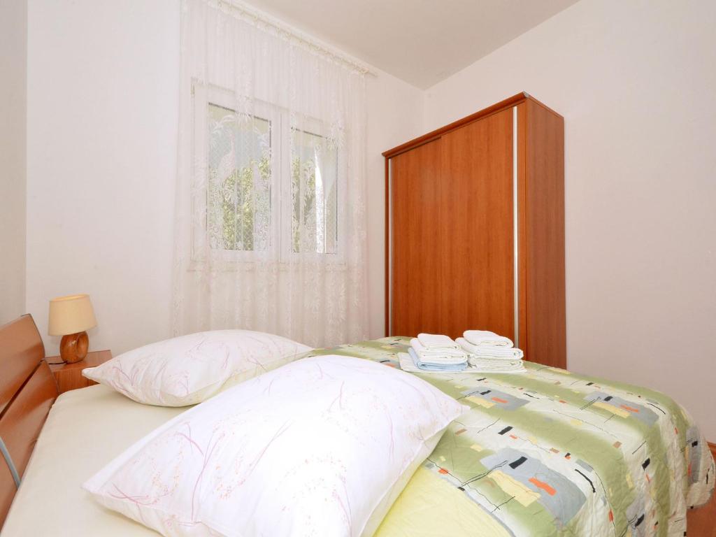 Posteľ alebo postele v izbe v ubytovaní Apartment NADA