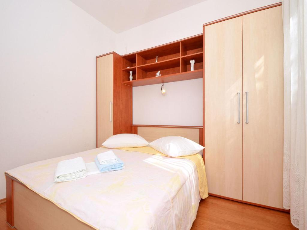Posteľ alebo postele v izbe v ubytovaní Apartment NADA