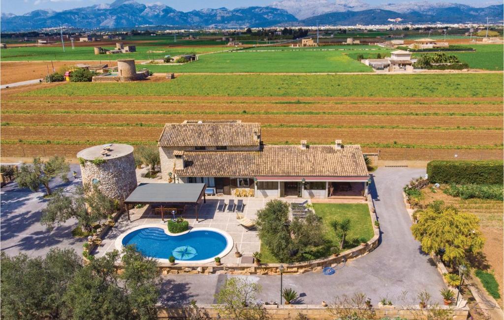 an aerial view of a farm house with a swimming pool at Awesome Home In Muro With 4 Bedrooms, Outdoor Swimming Pool And Swimming Pool in San Lorenzo