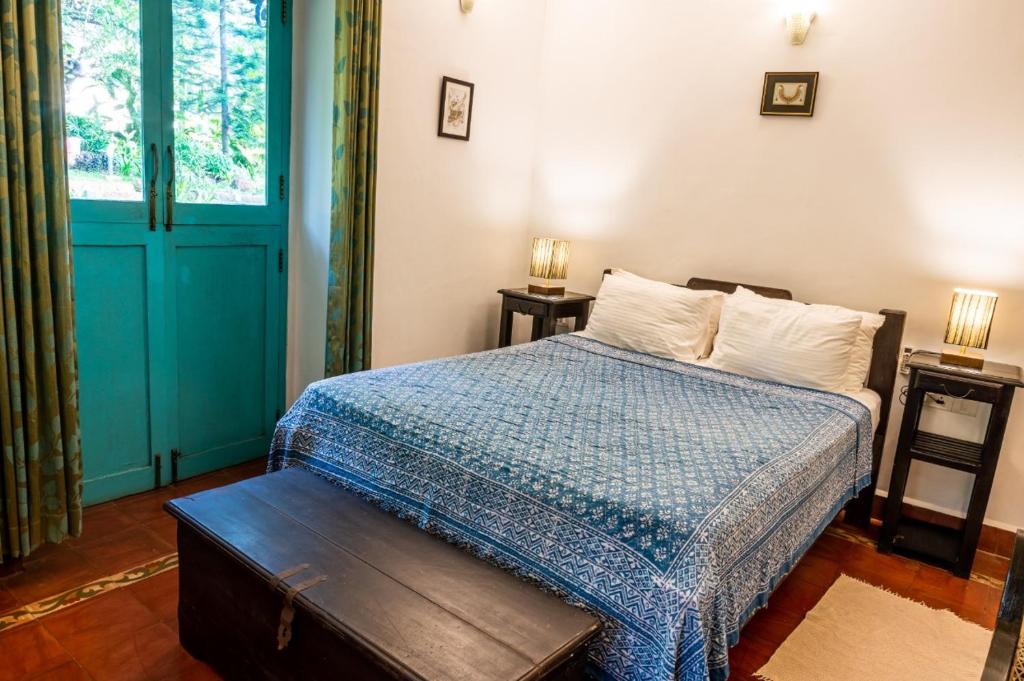Postel nebo postele na pokoji v ubytování Island House Goa