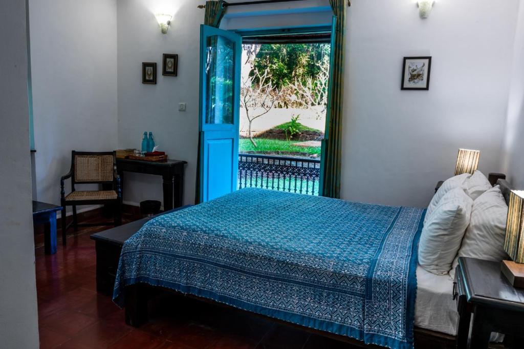 Postel nebo postele na pokoji v ubytování Island House Goa