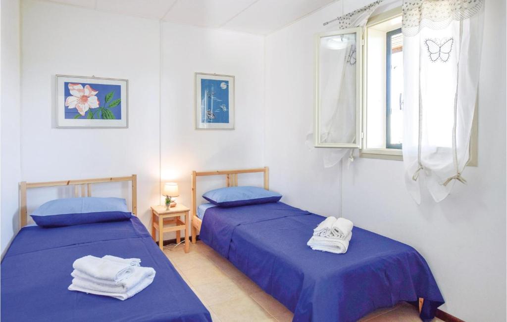 A bed or beds in a room at Villa Andrea