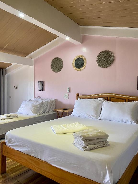 Postel nebo postele na pokoji v ubytování Balai Tinay Guesthouse
