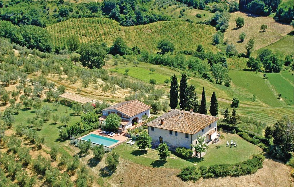 an aerial view of a house on a hill at Borgo Basso in Barberino di Val dʼElsa