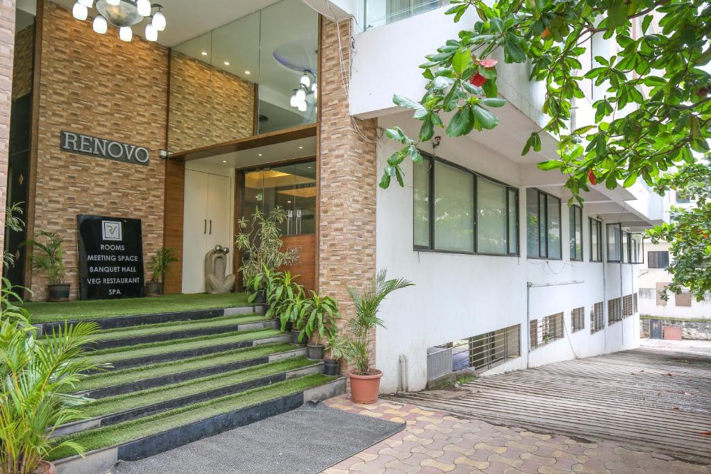 a building with stairs in front of it at The Gold Haven in Pune