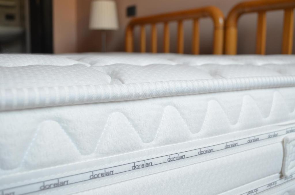 Postel nebo postele na pokoji v ubytování Albergo Giardino