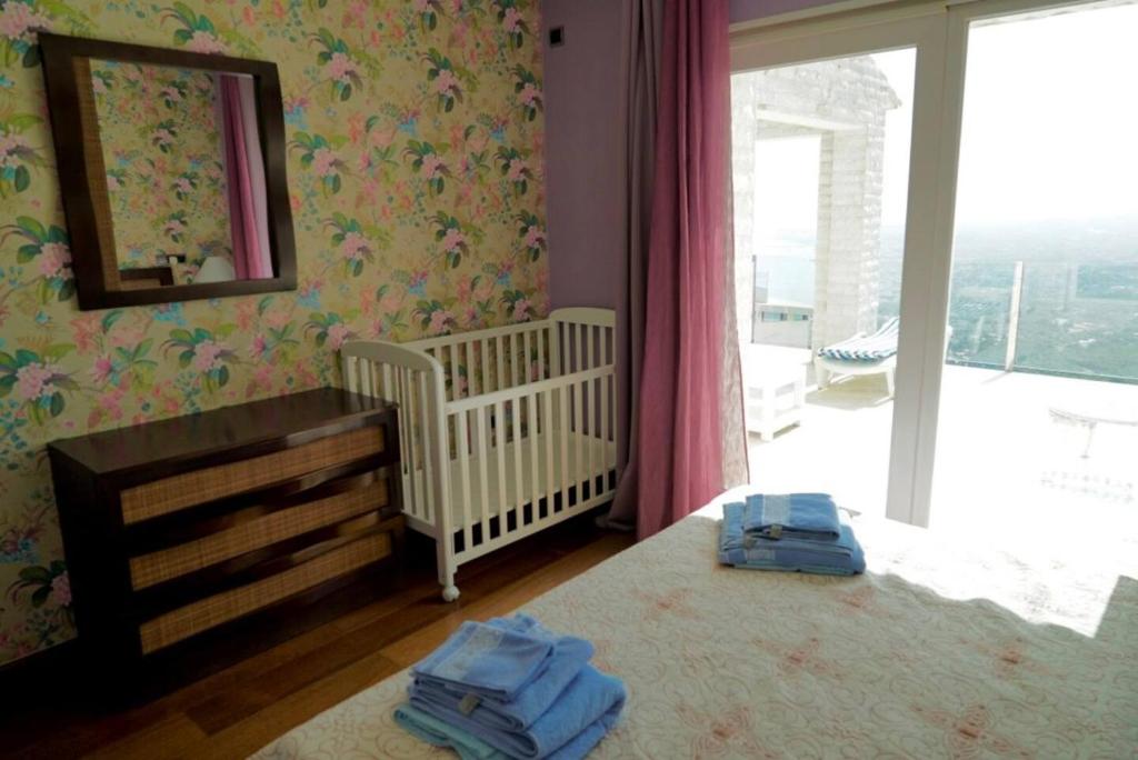 Postel nebo postele na pokoji v ubytování Villa Aleandra con Maravillosas Vistas al mar!