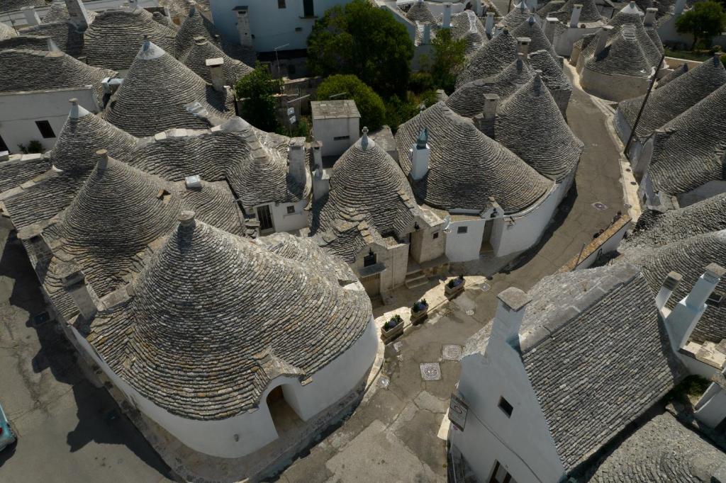 an aerial view of a group of roofs of buildings at Trulli Soave in Alberobello