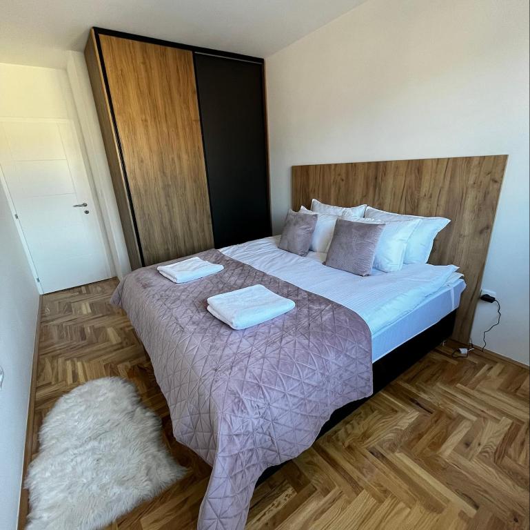 Кровать или кровати в номере Ema Residence Pale Jahorina