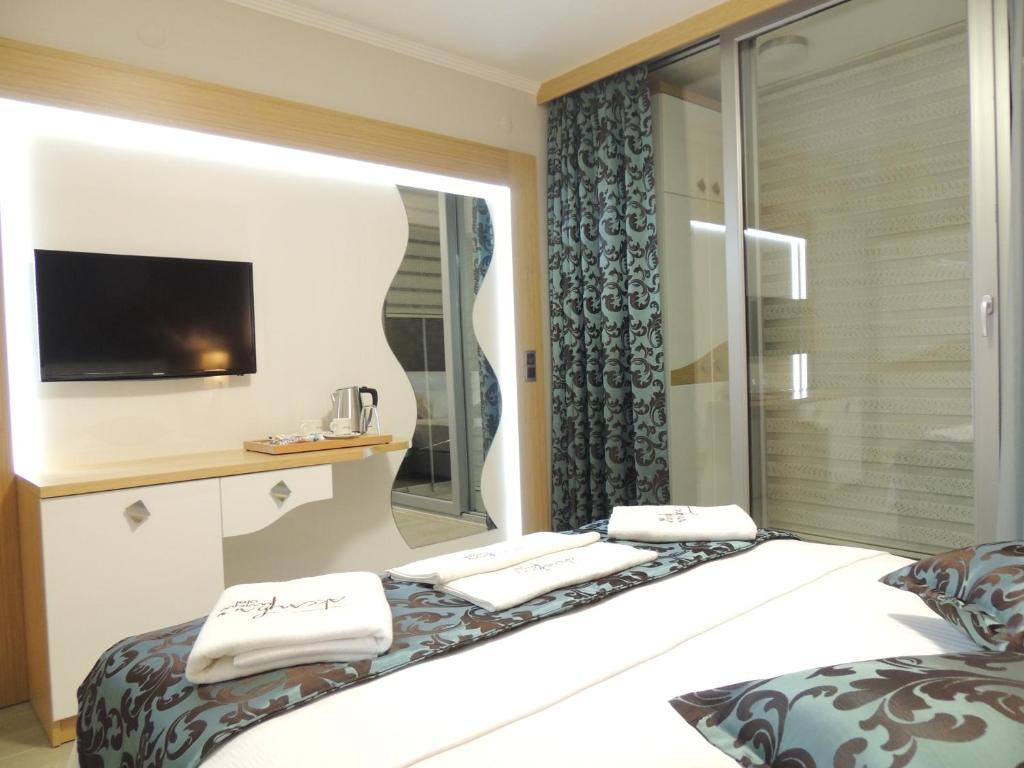 Postel nebo postele na pokoji v ubytování Akcayhan Hotel