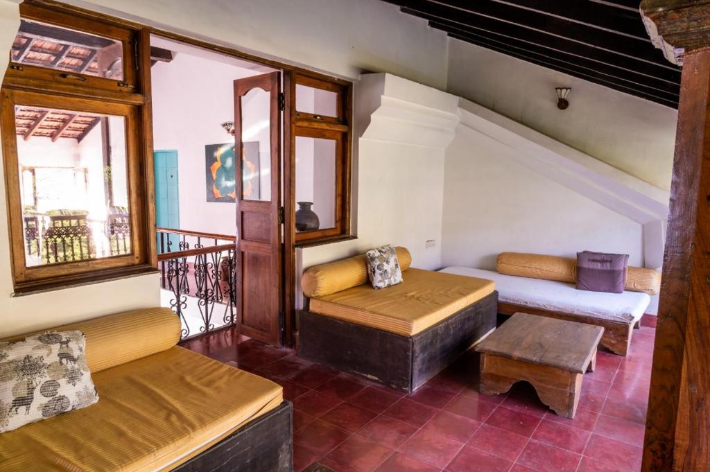 Postel nebo postele na pokoji v ubytování Island House Goa