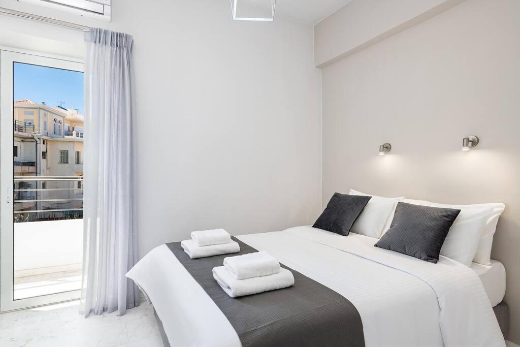 Posteľ alebo postele v izbe v ubytovaní West City Apartment