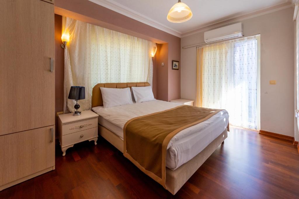 Postel nebo postele na pokoji v ubytování Vira Suites Hotel