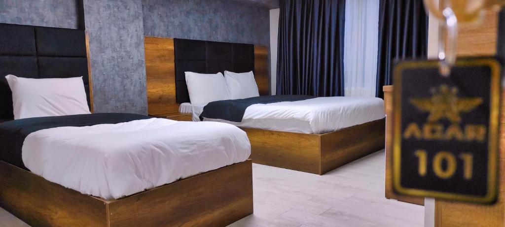 Ένα ή περισσότερα κρεβάτια σε δωμάτιο στο Acar Airport Hotel Plus