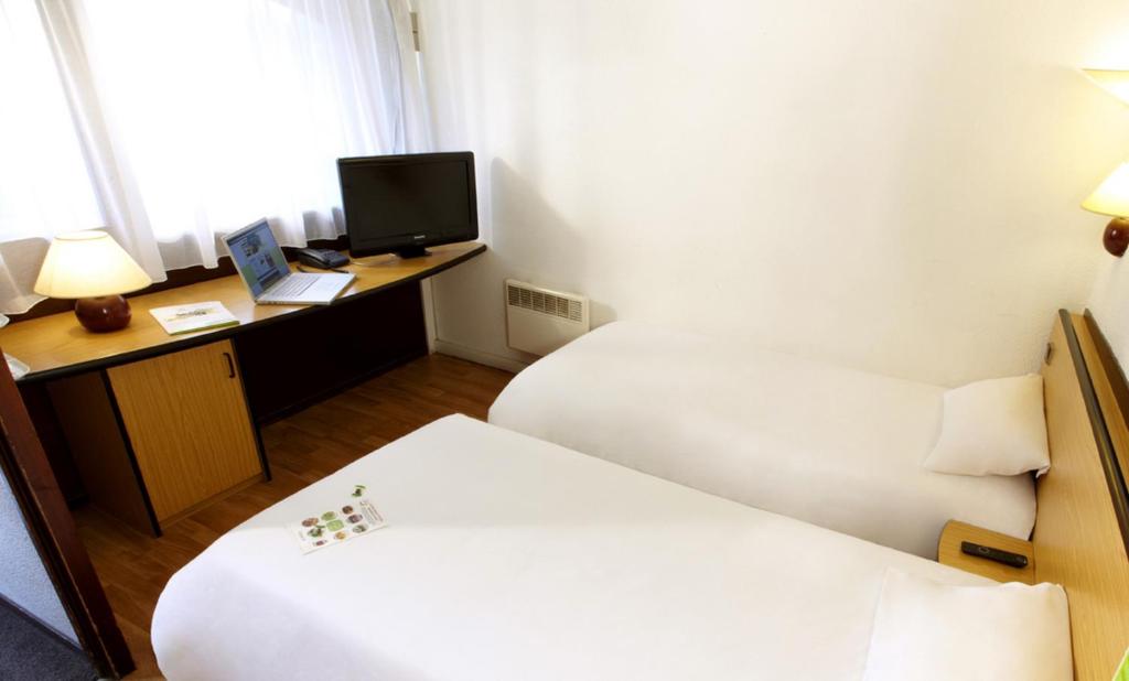 Postel nebo postele na pokoji v ubytování Campanile Hotel & Restaurant Gouda