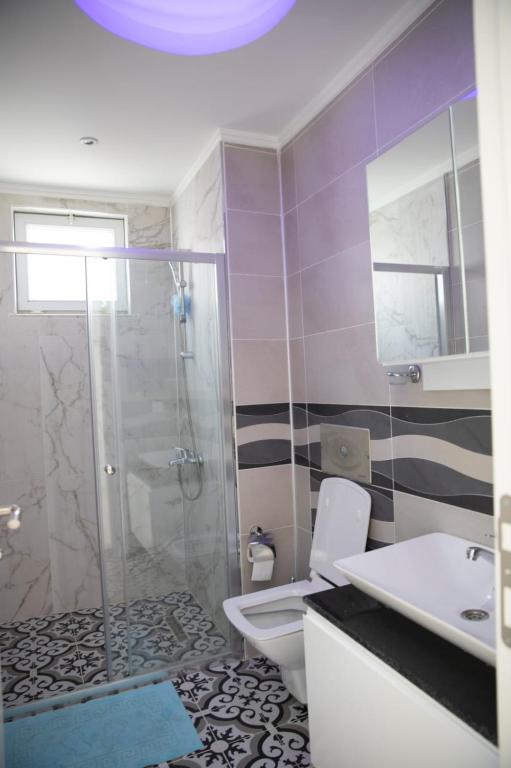 A bathroom at Sunrise hill villa with private pool