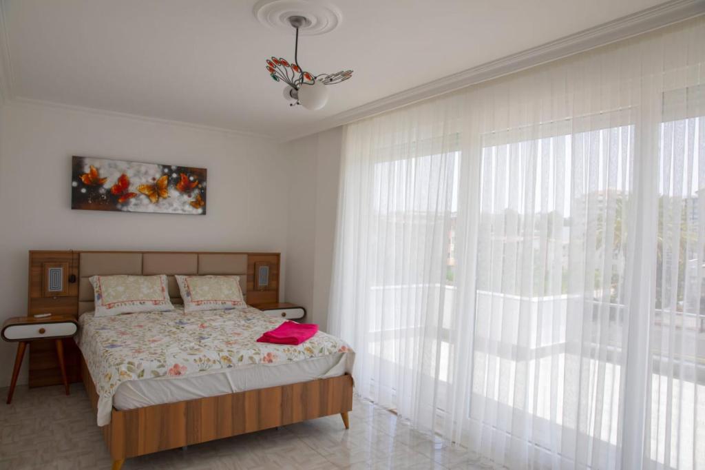 A bed or beds in a room at Sunrise hill villa with private pool